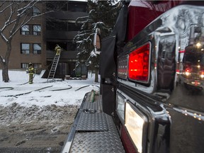 Firefighters put out a fire in a McCauley neighbourhood apartment building on Wednesday, Dec. 16, 2015.