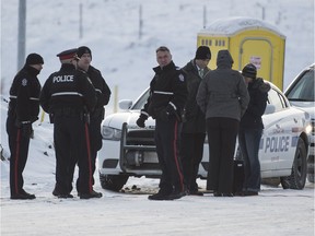 Police investigate after a woman's body was found in front of houses under construction in northeast Edmonton on Christmas Day.