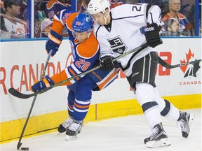 Edmonton Oilers Lauri Korpikoski (28) battles Los Angeles Kings Nick Shore (21) during first period NHL hockey action at Rexall Place in Edmonton December 29, 2015.