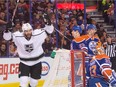 Los Angeles Kings' Dwight King celebrates his first goal of the season to open the floodgates on Edmonton Oilers goalie Cam Talbot  during the second period of an NHL game at Rexall Place on Tuesday, Dec. 29, 2015.