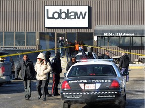 Employees leave the scene of a stabbing at the Loblaw warehouse on Feb. 28, 2014.