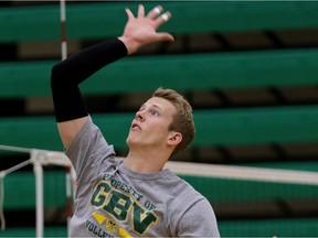 Alex McMullin hits the ball during University of Alberta Golden Bears volleyball team practice in January 2015 at the  Saville Community Sports Centre.