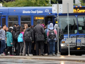 Riders catch buses from the Millwoods Transit Centre in Edmonton on Sept. 10, 2014.