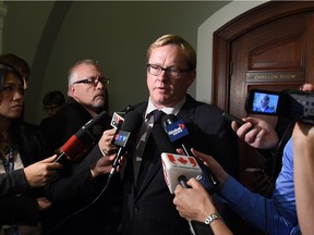 Education Minister David Eggen speaks to media at the legislature in Edmonton on Sept. 23, 2015.