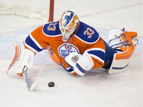 Edmonton Oilers' goalie Cam Talbot jumps on the puck against the Winnipeg Jets at Rexall Place on Dec. 21, 2015. He made 44 saves in the Oilers 3-1 victory.