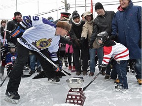 The ceremonial puck drop Tuesday at the 7th annual McCauley Cup, a friendly game of  hockey at the McCauley outdoor rink between Edmonton police officers and children from the neighbourhood.