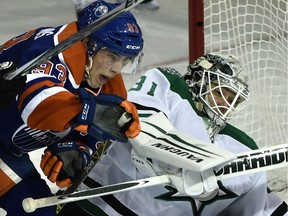 Oilers forward Ryan Nugent-Hopkins battles in front of Dallas Stars goalie Antti Niemi during NHL action at Edmonton's Rexall Place on Dec. 4, 2015.