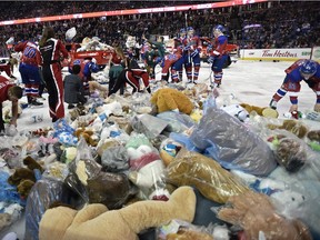 Mounds of stuffed animals litter the ice at the Edmonton Oil Kings' ninth annual Teddy Bear Toss at Rexall Place on December 5, 2015. The Oil Kings defeated the visiting Swift Current Broncos 2-1 in WHL action.