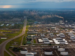 This is an aerial view of the Imperial Oil Strathcona refinery with the Kinder Morgan and Enbridge oil terminals in the foreground and the Edmonton skyline in the background on July 31, 2011.