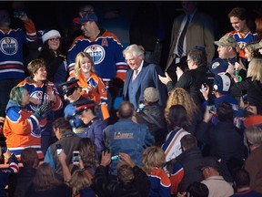 Former Oilers coach and GM Glen Sather makes his way through the Rexall Place crowd to centre ice for the banner-raising ceremony in his honour on Friday, Dec. 11, 2015.