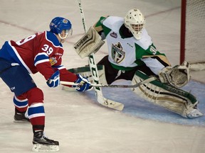 Brett Pollock of the Edmonton Oil Kings is stopped on a breakaway by Prince Albert Raiders goaltender Rylan Parenteau during a Western Hockey League game at Rexall Place on Dec. 8, 2015.