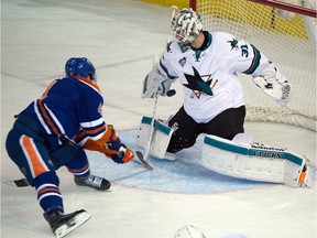 Taylor Hall scores the game-winning goal on Sharks netminder Martin Jones as the Edmonton Oilers beat the San Jose Sharks 4-3 in overtime at Rexall Place on Wednesday, Dec. 9, 2015.