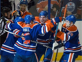 The  Oilers celebrate a goal as the Edmonton Oilers beat the new York Rangers 7-5 at Rexall place  in Edmonton, Dec. 9, 2015.