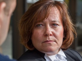 Michelle Doyle, Edmonton's chief Crown prosecutor, speaks to the media after Travis Vader was acquitted on weapons and drug charges, outside the provincial courthouse in Edmonton on October 8, 2014.