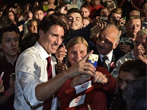 Federal Liberal Leader Justin Trudeau was taking selfies while attending a rally with candidates and supporters at the Radisson Hotel in Edmonton, on Sept. 10, 2015.