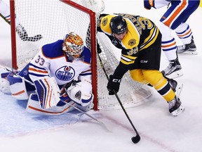 Zdeno Chara (33) of the Boston Bruins takes a shot against Oilers goalie Cam Talbot during the first period at TD Garden on Dec. 14, 2015 in Boston.