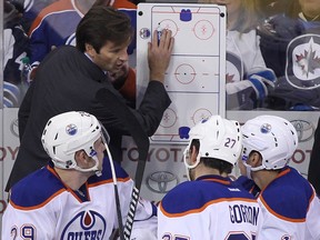 Head coach Dallas Eakins of the Edmonton Oilers gives his players direction from the bench.