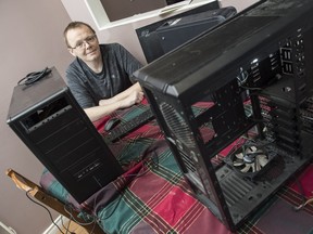 John Grierson is gathering donated equipment for Computers for Refugees, an effort to refurbish and distribute old laptops and desktops to Syrian refugees. Shaughn Butts/ Edmonton Journal