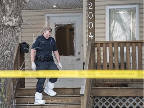 Edmonton Police collect evidence at a duplex in northeast Edmonton after a man died in custody after an incident at the home overnight.