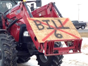 Farmers and ranchers show their opinions on the proposed Alberta government's Bill 6 during a convoy and protest in Okotoks, south of Calgary, December 2, 2015.