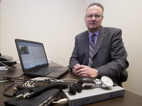 Ken Donaldson with his polygraph machine on December 14, 2015, in Edmonton.  (Greg Southam-Edmonton Journal)