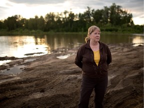 This June 19, 2013 file photo shows Christine Kenning, operations manager for the Cumulative Environmental Management Association (CEMA), at Snye Park in Fort McMurray.
