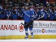 Colorado Avalanche right wing Jarome Iginla, front, is congratulated by teammates after scoring a goal against the New Jersey Devils in March 2015, in Denver. Iginla is three goals away from hitting the 600-goal mark.