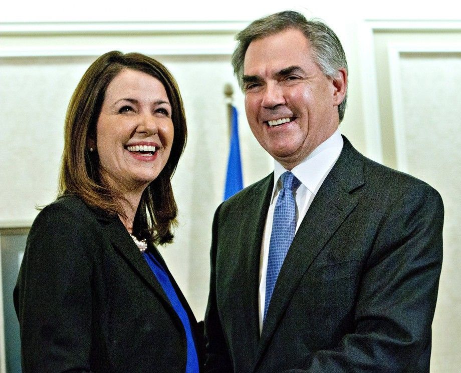 Alberta Premier Jim Prentice and former Wildrose Leader Danielle Smith speak to media after a caucus meeting in Edmonton on December 17, 2014. The former leader of the Reform Party says he made a mistake when he gave advice to members of Alberta's Wildrose on uniting with the governing Progressive Conservatives. Preston Manning met last week with the Wildrose caucus to talk about his attempts to join the Reform Party with the federal Progressive Conservatives under the Canadian Alliance banner. A day after the meeting, Wildrose Leader Danielle Smith and eight others crossed the floor of the provincial legislature and called on the party to merge with the Tories. THE CANADIAN PRESS/Jason Franson stock photo STK_