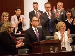 Alberta Finance Minister Joe Ceci is applauded after his budget address on Oct. 27, 2015.