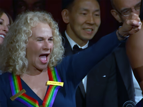 Singer/songwriter Carole King reacts to her song being sung by legend Aretha Franklin at the Kennedy Center Honors.