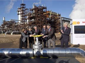 From left, Alberta Energy Minister Marg McCuaig-Boyd, Shell Canada President Lorraine Mitchelmore, CEO of Royal Dutch Shell Ben van Beurden, Marathon Oil Executive Brian Maynard, Shell ER Manager, Stephen Velthuizen, and British High Commissioner to Canada Howard Drake open the valve to the Quest carbon capture and storage facility in Fort Saskatchewan on Nov. 6, 2015. Quest is designed to capture and safely store more than one million tonnes of CO2 each year an equivalent to the emissions from about 250,000 cars.