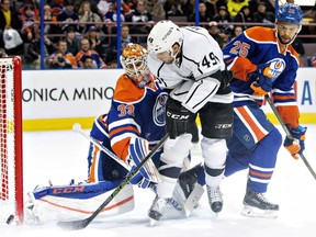 Edmonton Oilers defenceman Darnell Nurse helps goalie Cam Talbot stop Los Angeles Kings' Michael Mersch during an NHL game at Rexall Place on Dec. 29, 2015.
