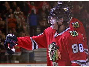 Patrick Kane of the Chicago Blackhawks celebrates his franchise record 23 game points streak against the Nashville Predators at the United Center on Dec. 8, 2015 in Chicago.