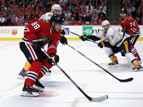 Patrick Kane (88) of the Chicago Blackhawks advances the puck against the Nashville Predators at the United Center on Dec. 8, 2015 in Chicago. Even Wayne Gretzky is impressed by Kane's current point streak.