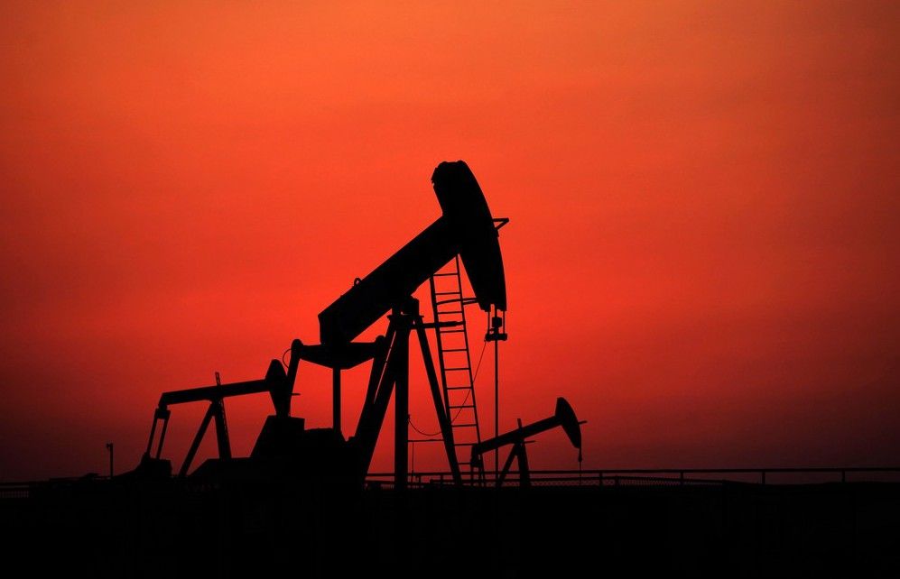 Oil pumps work at sunset on Sept. 11, 2013, in the desert oil fields of Sakhir, Bahrain. THE CANADIAN PRESS/AP, Hasan Jamali stock photo STK_