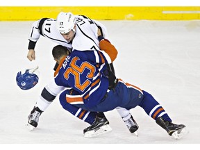 Edmonton's Darnell Nurse (25) fights Los Angeles' Milan Lucic (17) during the first period of the Edmonton Oilers' NHL hockey game against the LA Kings at Rexall Place in Edmonton, Alta., on Tuesday, Dec. 29, 2015. Codie McLachlan/Edmonton Sun/Postmedia Network