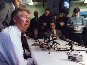 Edmonton Oilers general manager Glen Sather talks with sports reporters, including Journal hockey writer Jim Matheson, in this 1990 Journal file photo.