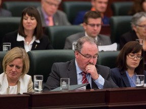 NDP House Leader Brian Mason, centre front, sits in the legislature at the beginning of the fall session. Mason has invoked closure on the controversial farm safety Bill 6 to shorten debate.