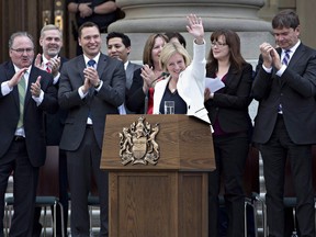 Rachel Notley is applauded after being sworn in as Alberta's 17th premier in Edmonton, Alta., on Sunday, May 24, 2015.