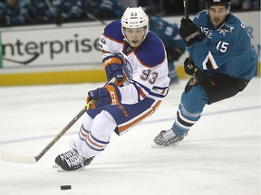 Edmonton Oilers center Ryan Nugent-Hopkins (93) skates past San Jose Sharks left wing James Sheppard (15) during the second period of an NHL hockey game Tuesday, Dec. 9, 2014, in San Jose, Calif.