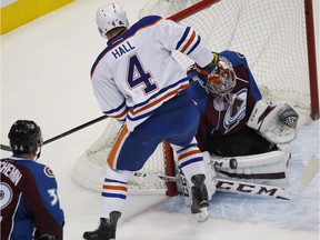 Colorado Avalanche goalie Semyon Varlamov stops a shot by Edmonton Oilers left wing Taylor Hall Saturday, Dec. 19, 2015, in Denver.