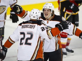 Anaheim Ducks' Shawn Horcoff celebrates with teammate Rickard Rakell after scoring the only goal in an NHL game  against the Calgary Flames at the Scotiabank Saddledome on Tuesday, Dec. 29, 2015.