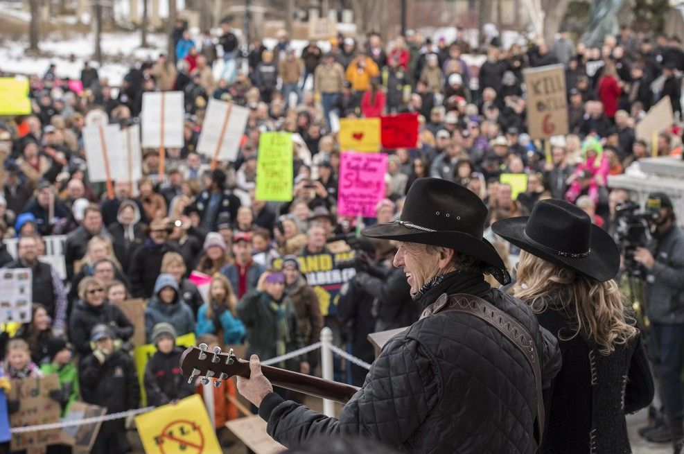 Greg Germscheid of Entwistle and his daughter Becky Hull sing a protest song. Hundreds of Alberta Farmers and ranchers descended on the Alberta Legislature to protest against Bill 6, the new farm safety legislation. Shaughn Butts/ Edmonton Journal