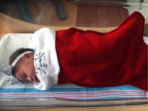 This Thursday Dec. 19, 2013 photo shows a newborn baby from Redlands, California. 
There is something extra special about babies born over the holiday season.
