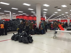 Piles of bags fill the 630 CHED Santas Anonymous depot Saturday at Bonnie Doon Centre, where hundreds of volunteers picked up toys to deliver to families across the city.  
Brea Elford/Edmonton Journal