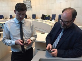 Edmonton Mayor Don Iveson and chief financial officer Todd Burge calculate the impact of funding decisions on individual homeowners during a break in budget talks on Dec. 3, 2015.