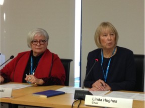 New Alberta Health Services board chair Linda Hughes, right, speaks at the board's first meeting in Edmonton on Tuesday, as AHS president and CEO Vickie Kaminski looks on.