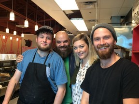 The Local Omnivore restaurant opens this week to satisfy your craving for craft sandwiches and smoked meat. From left, Brad Hafner, Mark Bellows, Kelsey Trites, Ryan Brodziak.
