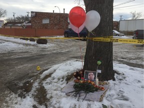 A small memorial was set up near 118th Avenue and 64th Street after a man was fatally shot in a back alley near that intersection on Thursday.