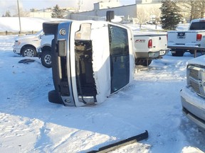 One of the vehicles knocked over in an industrial park in Red Deer after a man went on a rampage with a front-end loader on Christmas Day.